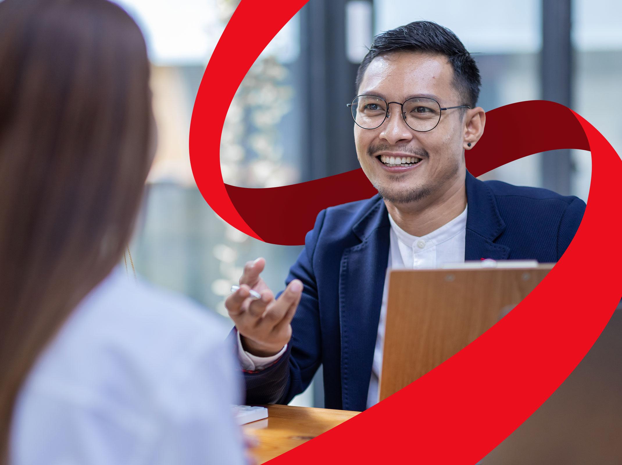 HR professional discussing employment law with co-worker