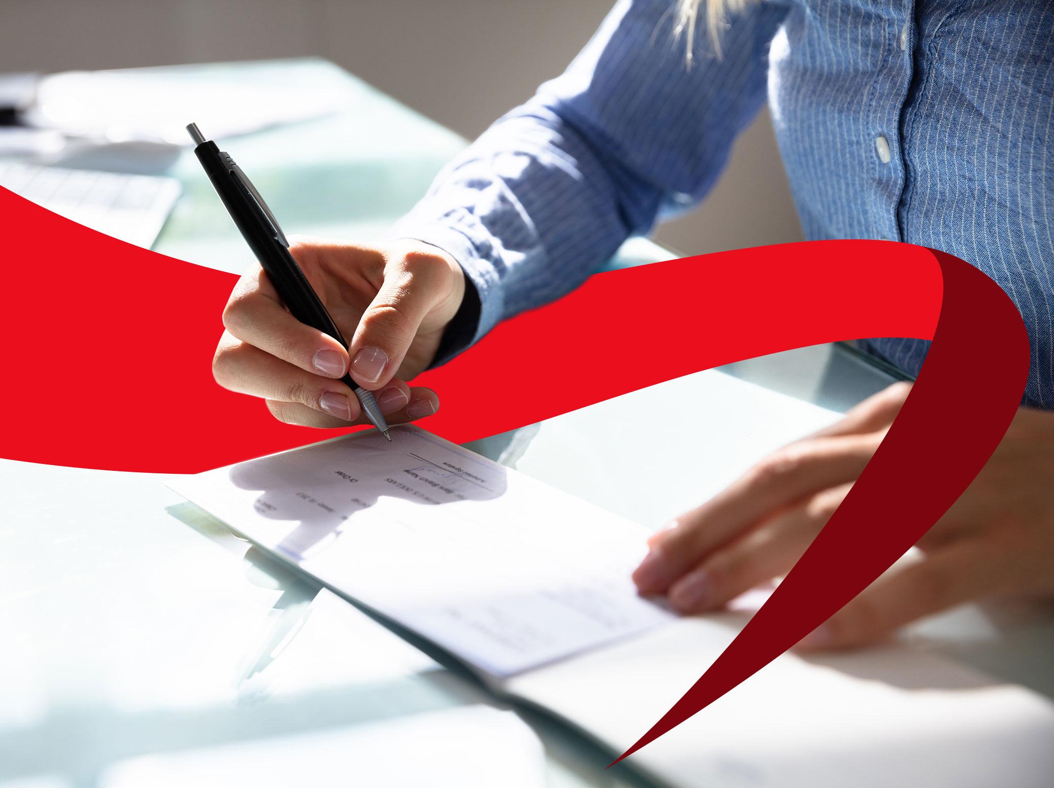 Payroll professional writing a check